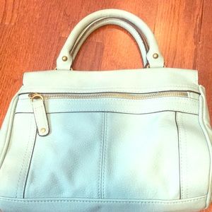 Turquoise handbag.